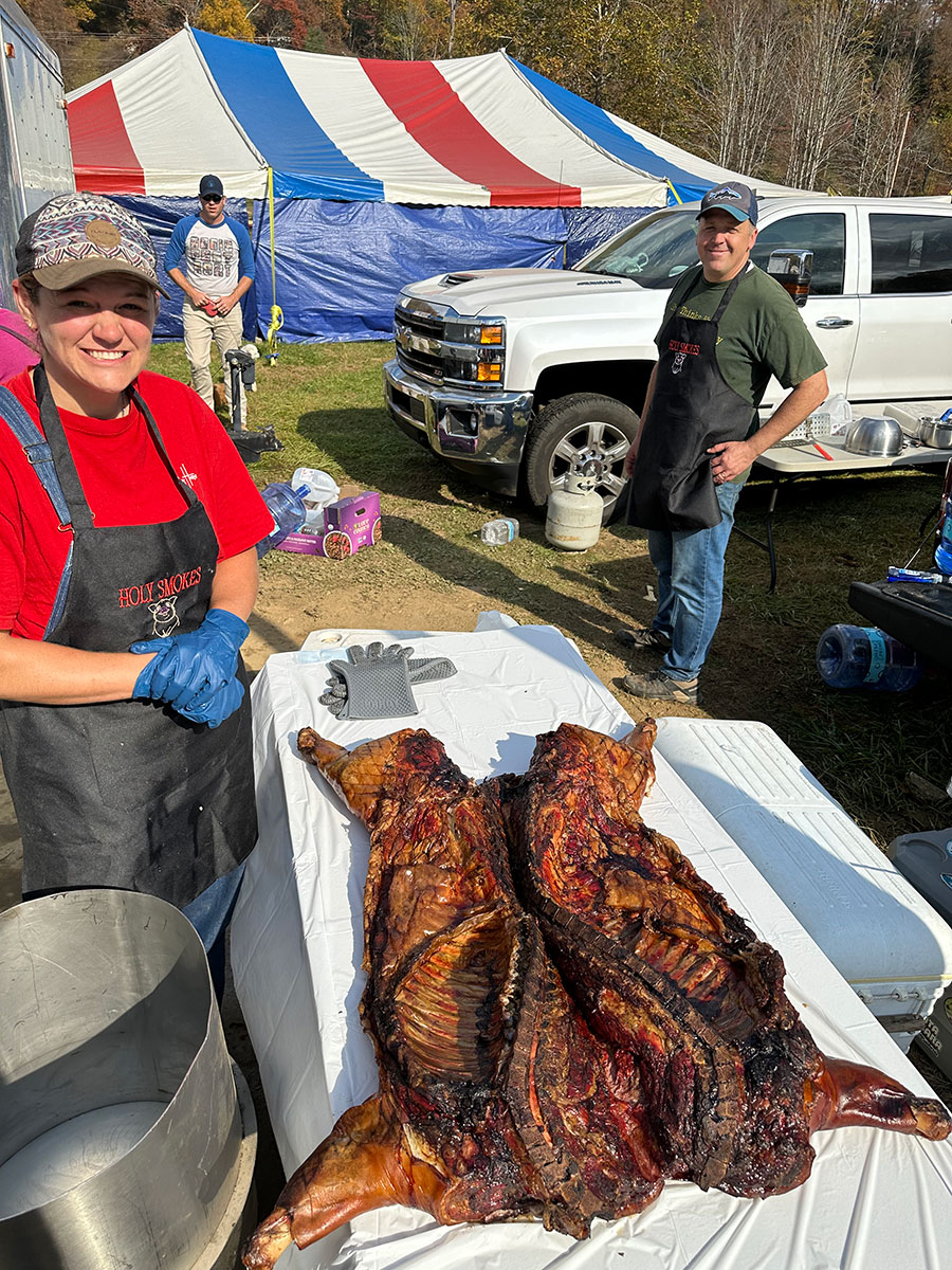 Holy Smokes pitmasters preparing whole hogs during Hurricane Helene relief efforts
